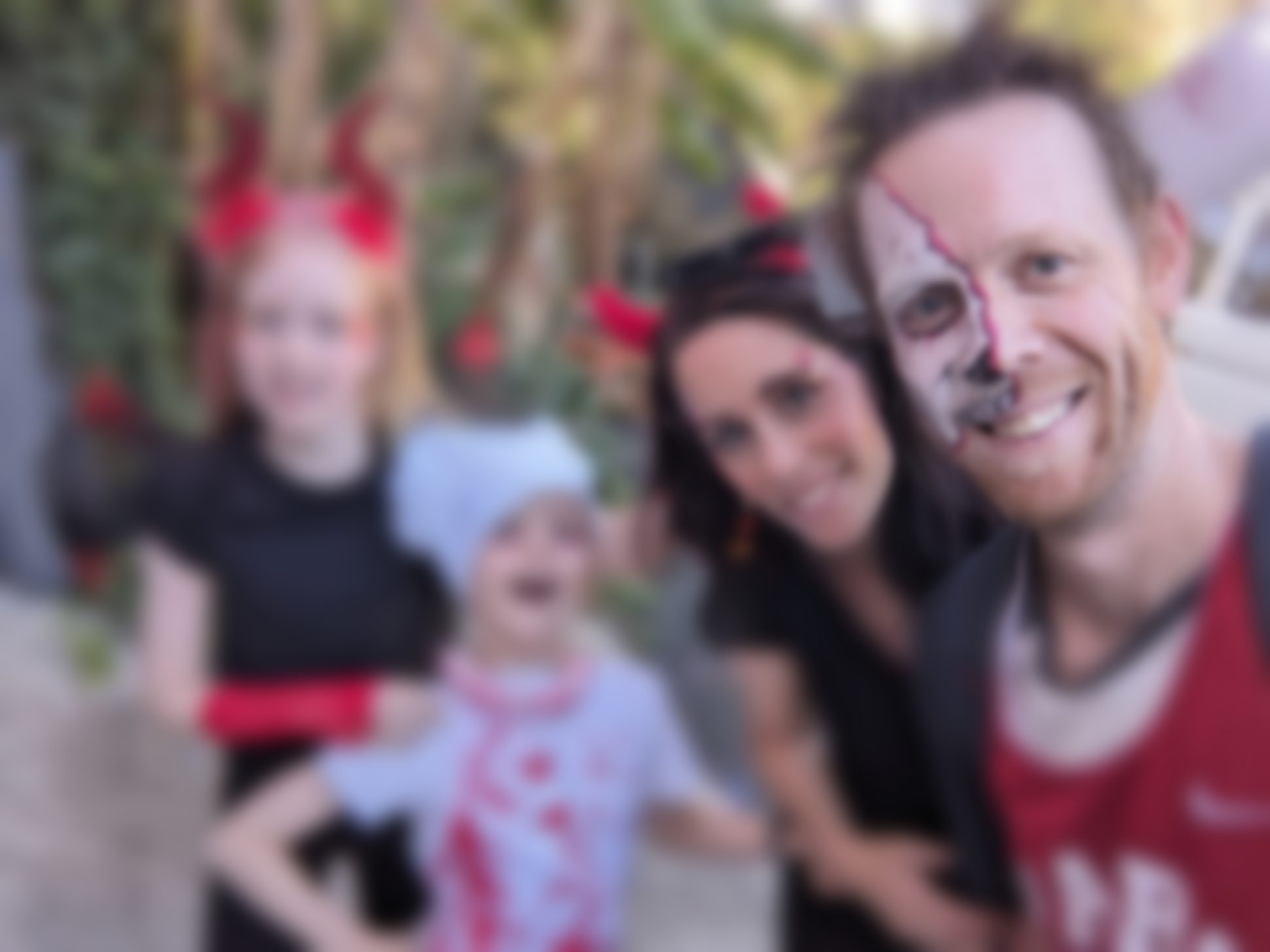 Family selfie in Halloween face paint